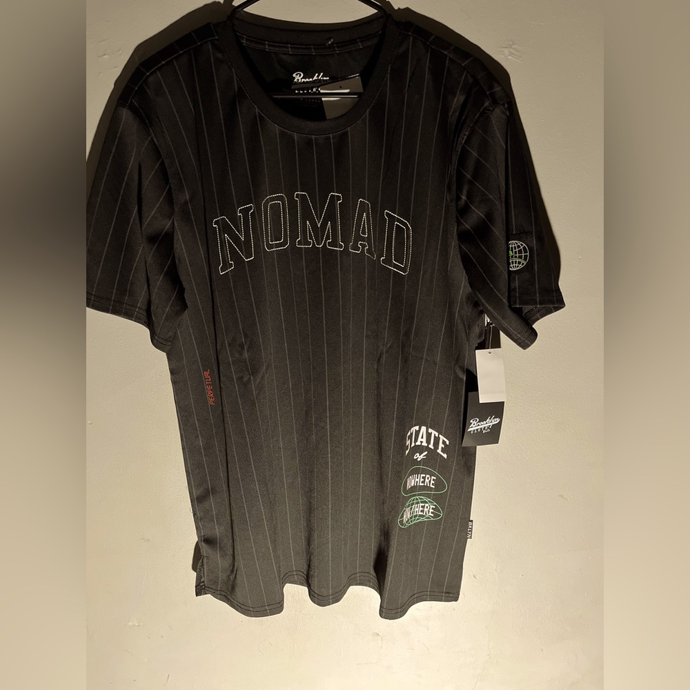 Brooklyn clothing black and white letter graphic Nomad  Tee.
Mesh material